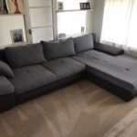 This is a photo of a grey L shape sofa that has been professionally steam cleaned, also the beige carpets have been steam cleaned too works carried out by Tooting Carpet Cleaning